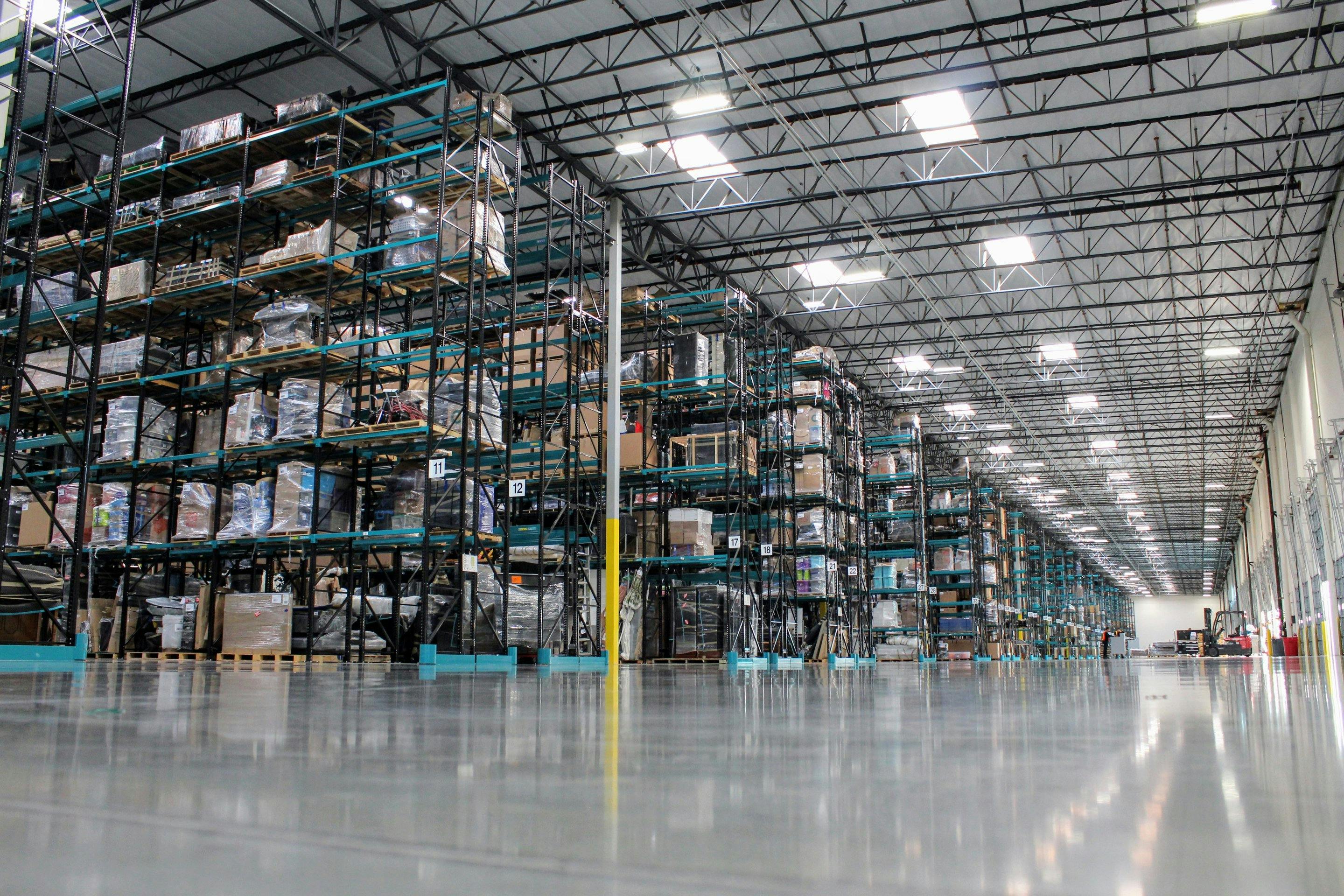 Clutter’s pristine warehouse, with large teal racks filled with neatly organized belongings